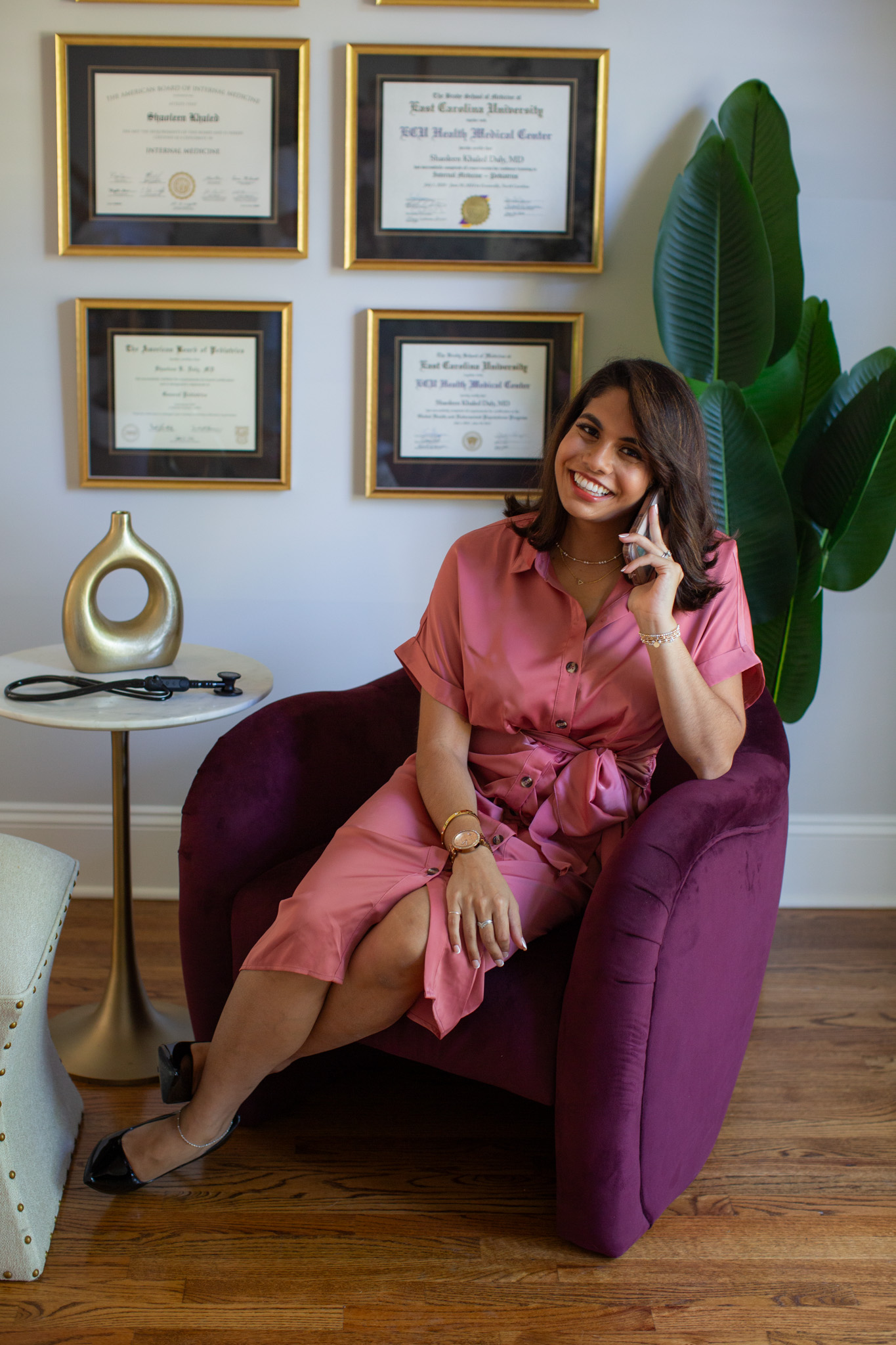 Dr. Shaoleen Daly seated in her office while speaking on the phone