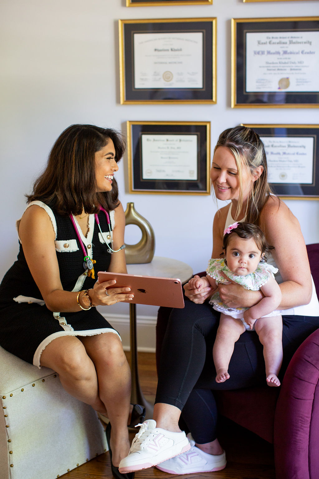 Dr. Daly caring for a mother and infant together